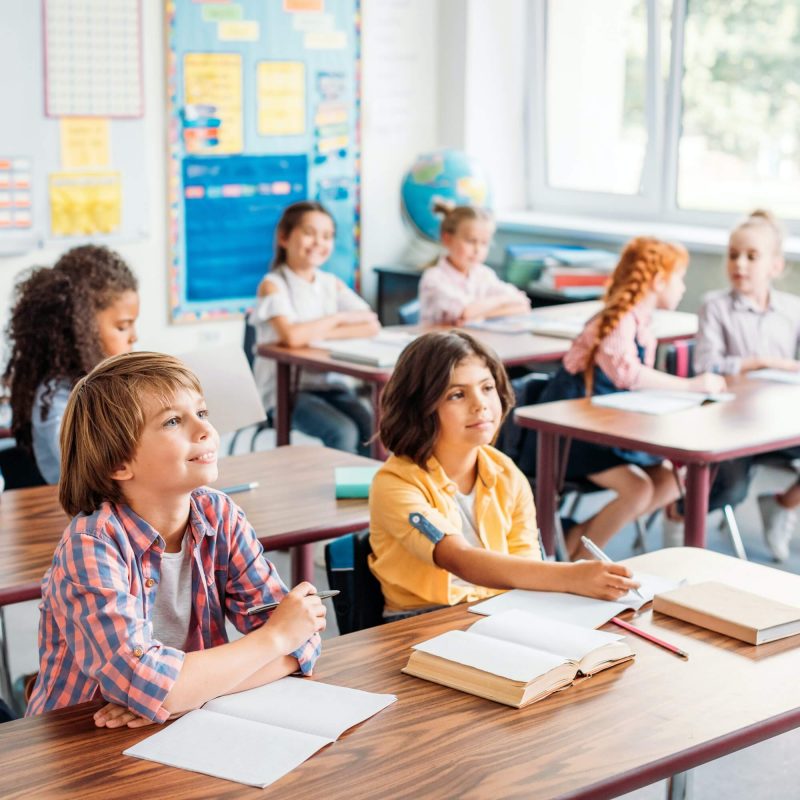 concentrated-little-kids-listening-teacher-in-class-on-lecture-1.jpg